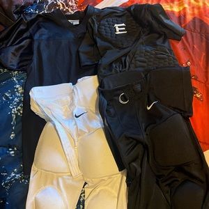 Size medium lot of youth Nike football gear
